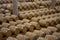 Wine barrels stacked in the cellar of the winery.