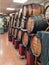 Wine barrels in a traditional wine shop, names chalked on the barrels. White, red wine and rosÃ©, tap wine sold in bulk in the