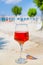 Wine on beach. A glass of tasty rose wine on sunny beach