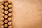 Wine bottle corks pattern on craft paper background top view copyspace. New Year celebration concept