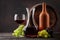 Wine bottle, decanter, glass and old wooden barrel