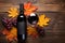 Wine bottle and fresh grape on table in Autumn. Healthy. Autumn seasonal concept.