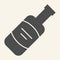 Wine bottle solid icon. Alcohol beverage symbol, glyph style pictogram on beige background. Merlot or Cabernet Sauvignon