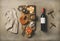 Wine bottle, vintage corkscrews, linen towel and appetizers board