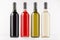Wine bottles collection different colors on white wooden board, mock up. Template for advertising, design, branding identity.