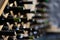 Wine bottles stacked on wooden racks