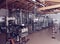 Wine bottling equipment line in a hangar, toned