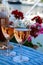 Wine and cake of French Riviera, glasses of cold rose Cote de Provence wine and Tarte Tropezienne cake in yacht harbour of Port