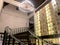 Wine cellar with wine bottle on shelf,classic indoor with wooden stairs and Chandelier