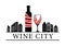Wine city. bottle and glass of red wine on the background of the city.