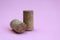 Wine cork two pieces on a pink background