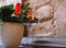 Wine cup with corks and vase with flowers in a table in a restaurant. Original decoration in a black table