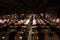 Wine enthusiasts in The Hess Collection Winery cellar during wine tasting tour in Napa, California