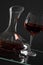 Wine glass and carafe with red wine