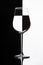 Wine glass with domino effect. Wineglass with liquid - refraction