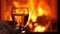 Wine glass in front of fireplace slowly coming into focus