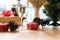 wine glass, gift box and pine cone near xmas tree. christmas and
