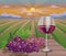 Wine glass and grapes in wineyard