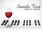 Wine glass and piano key on white background