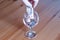 Wine glass on table coins paper money spent on alcohol closeup