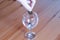 Wine glass on table coins paper money spent on alcohol closeup