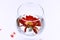 Wine glass with water and red gerbera