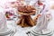 Wine glasses, napkins, bread and salad on the table.