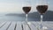 Wine glasses On Table Filled with Red Wine - romantic setting outdoors