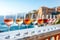 Wine glasses with varying shades of rose and white wine on marble bar with sunlit seascape background