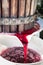 Wine grapes being crushed in basket press in Chianti area, Tuscany, Italy