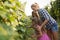 Wine grower family in vineyard before harvesting