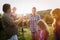 Wine grower family in vineyard before harvesting