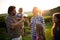 Wine grower family in vineyard talking and smiling