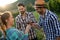 Wine grower and people in vineyard