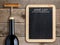 Wine list on blackboard and wine bottle