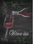 Wine list with wine glass and wine bottle on chalkboard background.