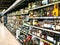 Wine shelves with price tags on display at store in Kharkov, Uktaine. Defocused rows of Wine Liquor bottles on th