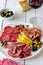 Wine snack. Prosciutto, Parma ham, salami, almonds, olives, baguette, blue cheese, parmesan. Antipasti