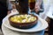 Wine and tapas in Madrid served on a bar tableSpanish Tapas: Hot prawn ceramics plate boiled.