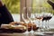 Wine tasting, cheese platter and winery restaurant with alcohol and glass for customer. Waiter, drink and sommelier with