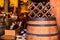 Wine tasting in winery - Wooden barrels and bottles of aged excelent wine