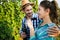 Wine tourists tasting wine in vineyard