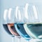 Wine Varieties. Four Glasses of Wine on Table â€“ Red Wine, Rose, White and Blue Wine