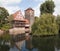 Wine Warehouse, Water Tower and the Bridge of the executioner on the river Pegnitz. Nuremberg. Germany.