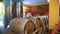 wine warehouse. wine Vault. Many wooden barrels of wine are stored in the cellar of the winery. Storage Room for Wine in