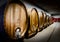 Wine wood barrels in a winery of langhe region in northern italy