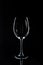 Wineglass on black reflecting tabletop