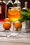 Wineglass with orange beverage.