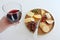 Wineglass with red wine over a cheese platter