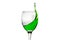 Wineglass with splashing drops of green alcohol cocktail